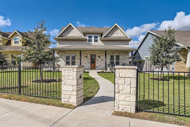 1100 Railroad Ave, Georgetown, TX 78626 - view of front of house with board and batten siding, covered porch, a fenced front yard, and a front lawn