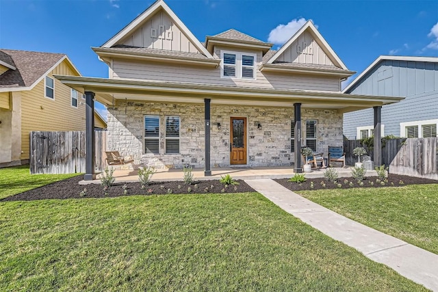 1100 Railroad Ave, Georgetown, TX 78626 - bungalow with stone siding, board and batten siding, covered porch, and a front yard