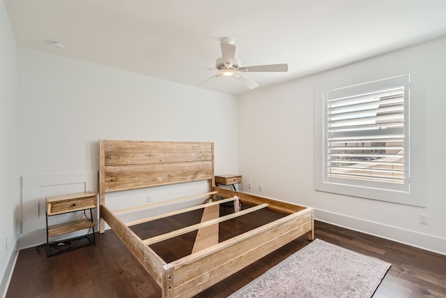 bedroom with ceiling fan and dark hardwood / wood-style floors