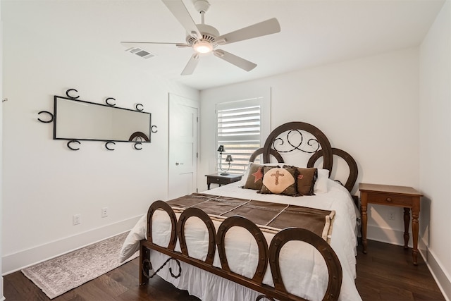 bedroom featuring ceiling fan and dark hardwood / wood-style floors