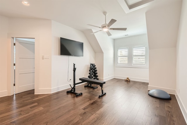 exercise room featuring lofted ceiling, dark wood-type flooring, and ceiling fan