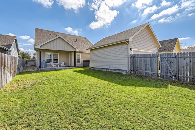 1100 Railroad Ave, Georgetown, TX 78626 - rear view of house with a lawn, a fenced backyard, and roof with shingles