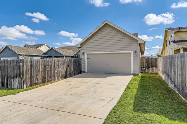 garage featuring a lawn