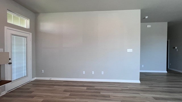 spare room featuring dark hardwood / wood-style flooring