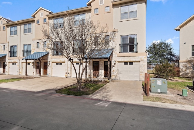 multi unit property featuring a garage