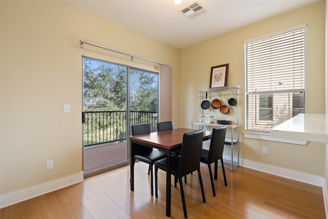 dining space featuring light hardwood / wood-style flooring