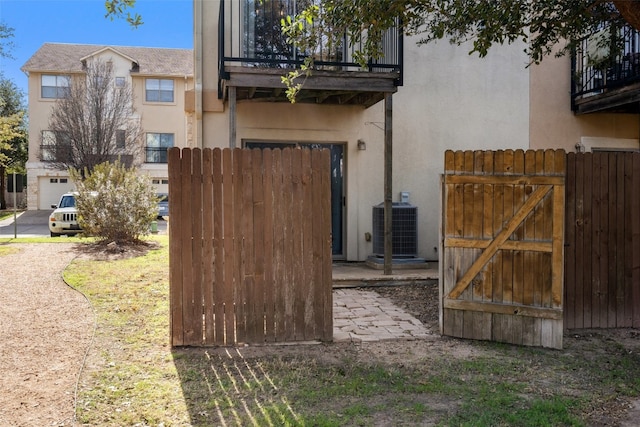 view of gate featuring central AC unit