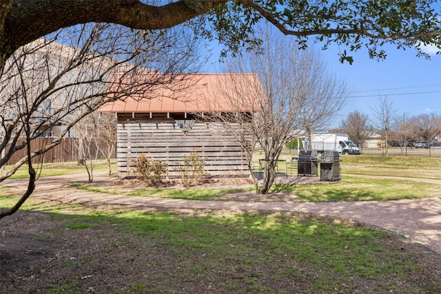 view of property exterior featuring a lawn