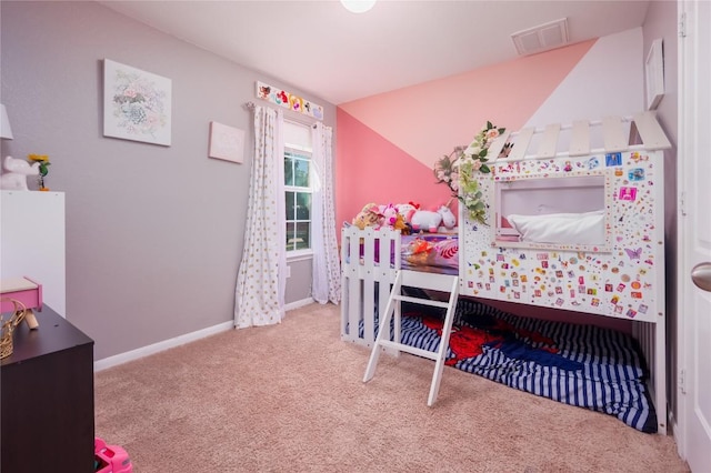 bedroom featuring light colored carpet