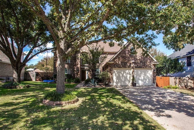 view of front of home with a front yard and a garage