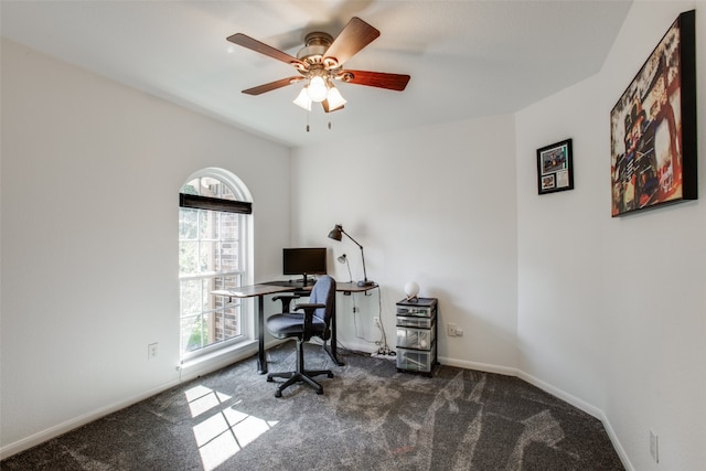 office featuring dark colored carpet and ceiling fan