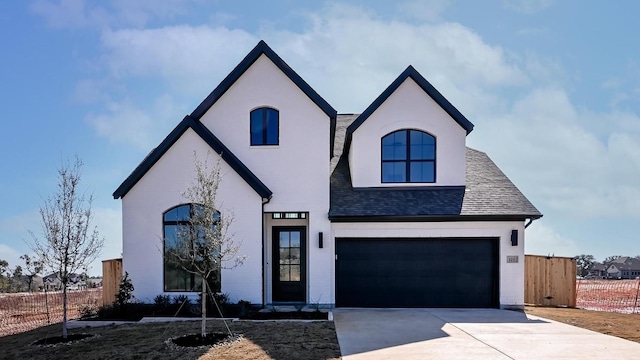 french country home with a garage