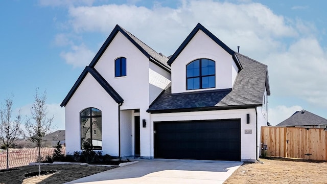 120 Teakmill Trl, San Marcos, TX 78666 - french provincial home featuring an attached garage, concrete driveway, roof with shingles, and stucco siding