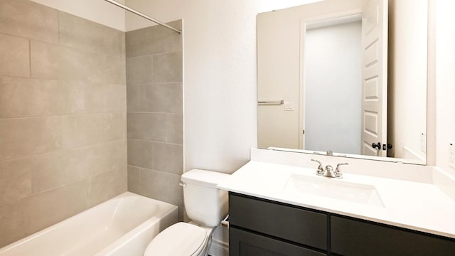 full bathroom with tiled shower / bath combo, vanity, and toilet