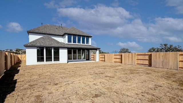 120 Teakmill Trl, San Marcos, TX 78666 - back of house featuring a shingled roof, a fenced backyard, and brick siding