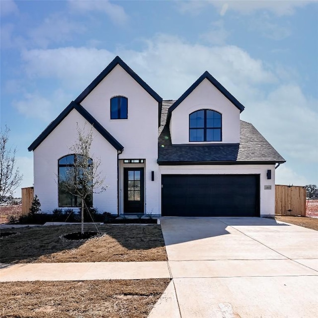 120 Teakmill Trl, San Marcos, TX 78666 - view of front facade featuring a garage, driveway, and stucco siding