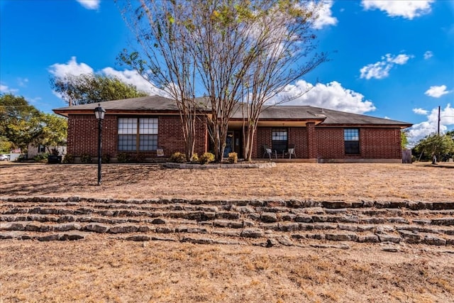 view of front of property featuring brick siding