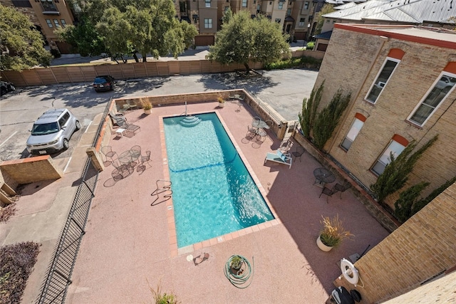 view of swimming pool with a patio area