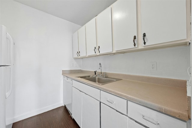 kitchen featuring sink, white cabinetry, white appliances, and dark hardwood / wood-style flooring