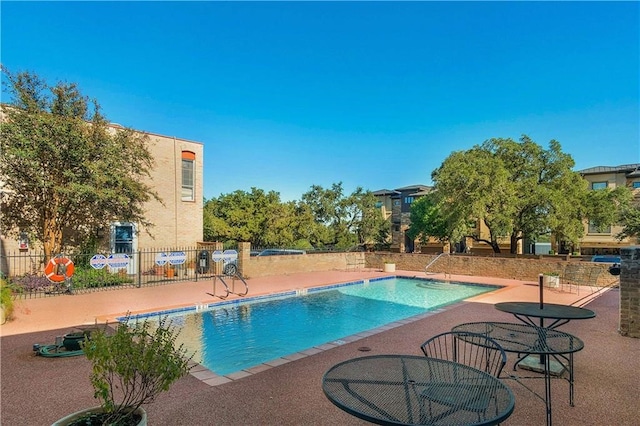 view of swimming pool with a patio area