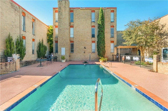 view of pool featuring a patio