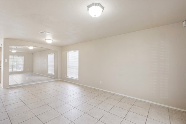 empty room with light tile patterned floors