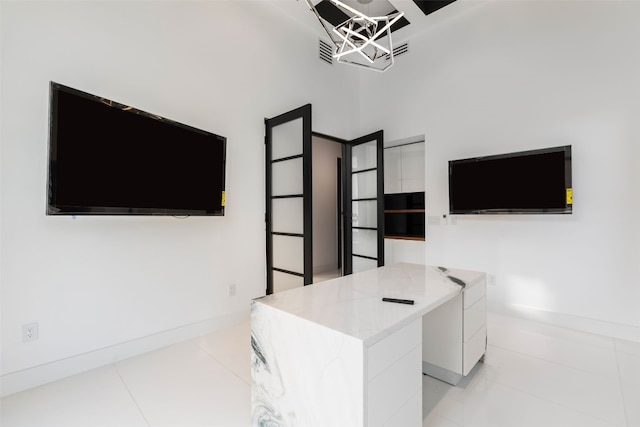 tiled office with a towering ceiling