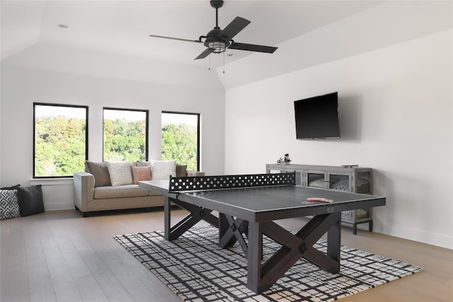 playroom with lofted ceiling, ceiling fan, and light wood-type flooring