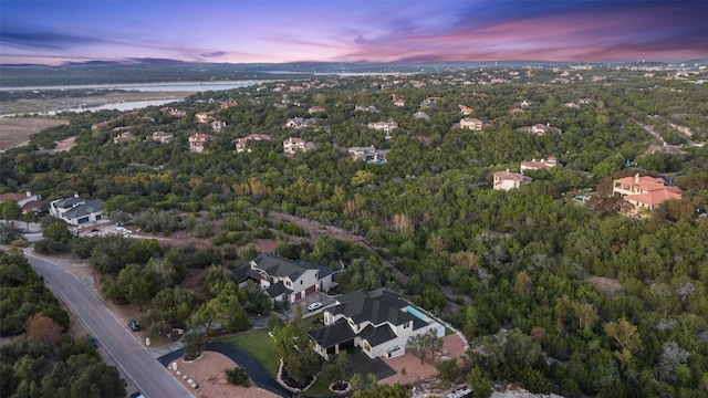 aerial view at dusk with a water view