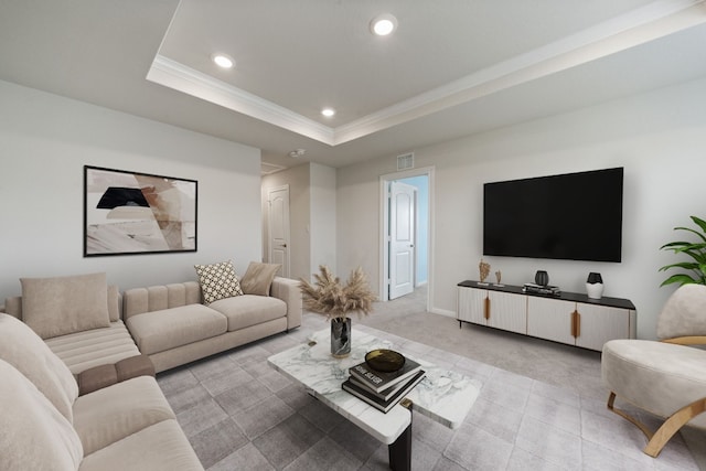 living room with a tray ceiling and light colored carpet