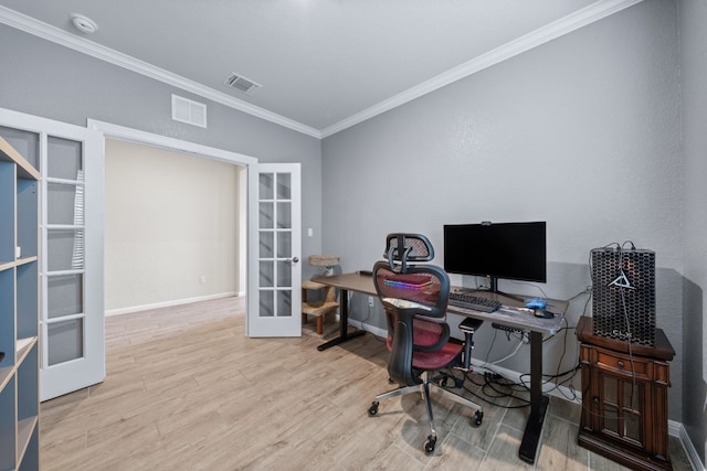 office with ornamental molding, french doors, and light hardwood / wood-style floors