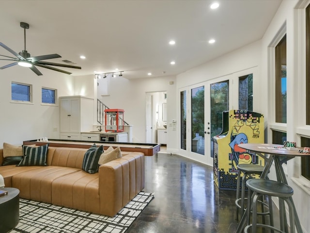 living room with french doors and ceiling fan