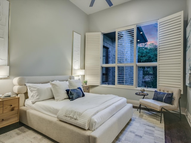 bedroom with light hardwood / wood-style floors and ceiling fan