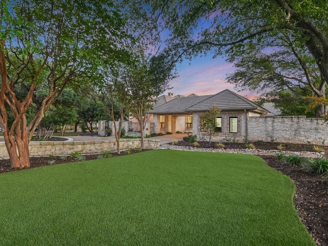 view of front of house with a yard