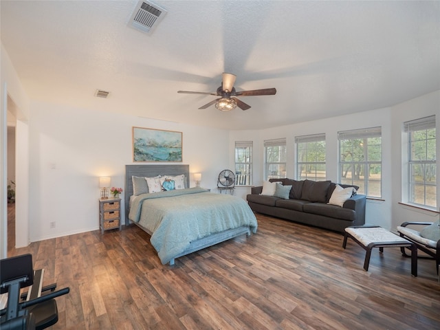 bedroom featuring ceiling fan and dark wood-type flooring