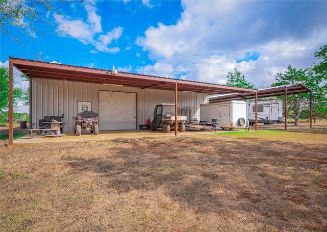 view of outbuilding featuring a garage