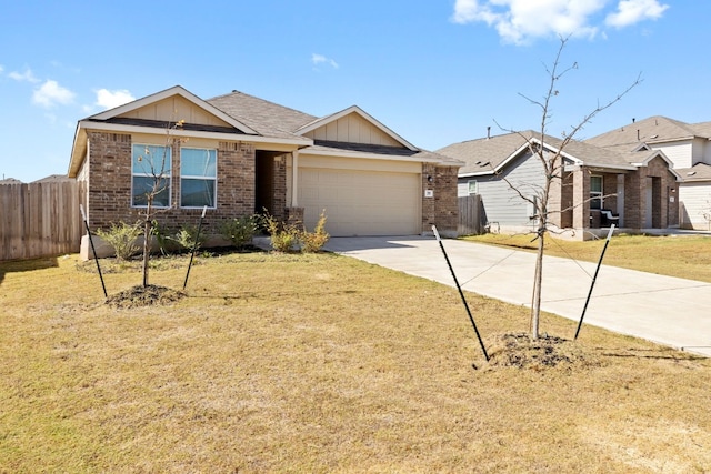 view of front facade with a front yard and a garage