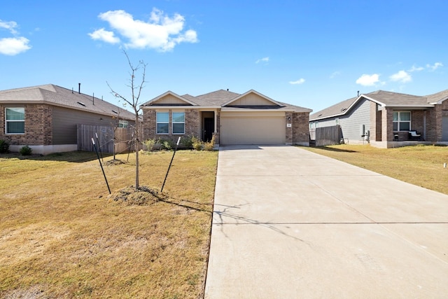 single story home featuring a front yard and a garage