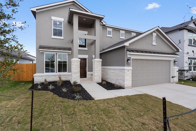 view of front facade with a front yard and a garage