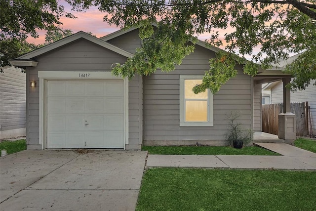 single story home with a garage