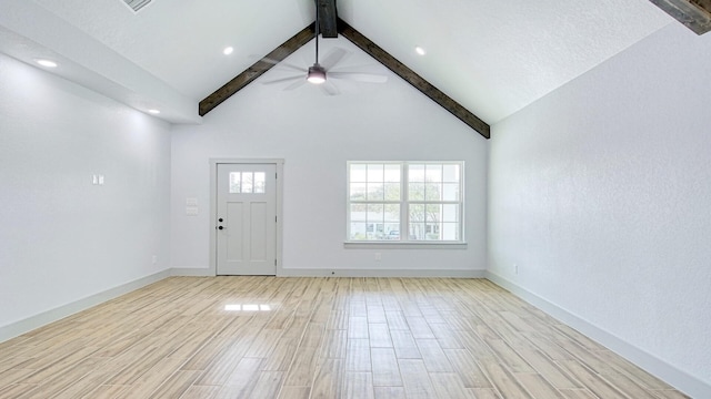 foyer featuring ceiling fan, beamed ceiling, and high vaulted ceiling