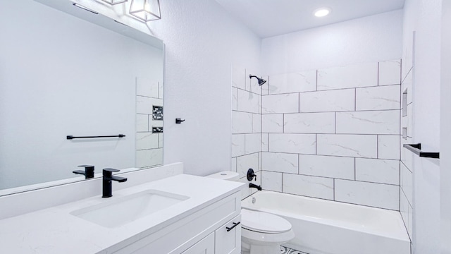 full bathroom with tiled shower / bath combo, toilet, and vanity