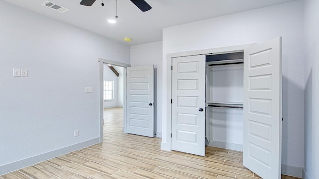 unfurnished bedroom featuring a closet and ceiling fan