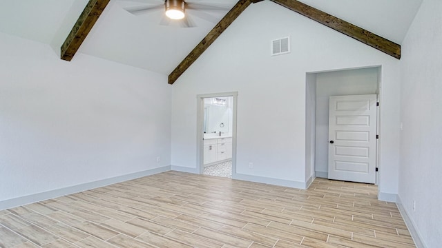 interior space featuring beam ceiling, high vaulted ceiling, and ceiling fan