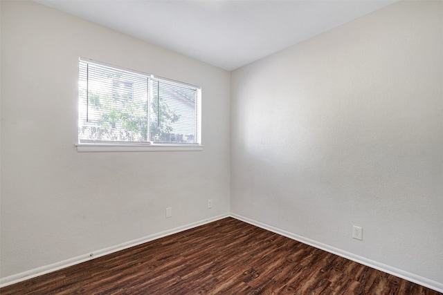 unfurnished room featuring dark hardwood / wood-style floors