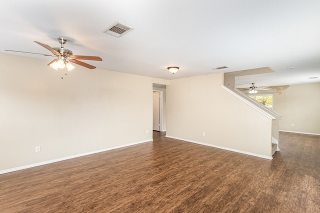 empty room with dark hardwood / wood-style floors