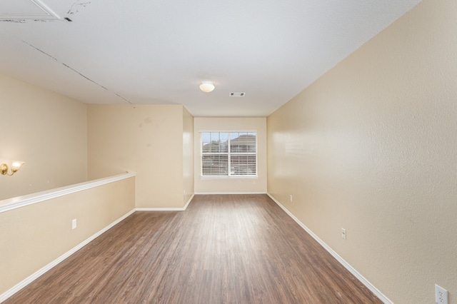 empty room featuring hardwood / wood-style flooring