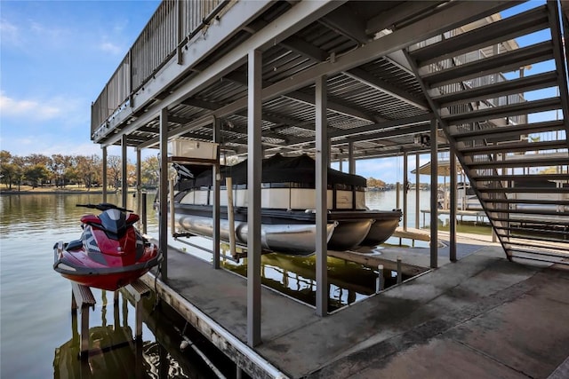 dock area with a water view