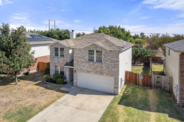 view of front facade with a front lawn and a garage