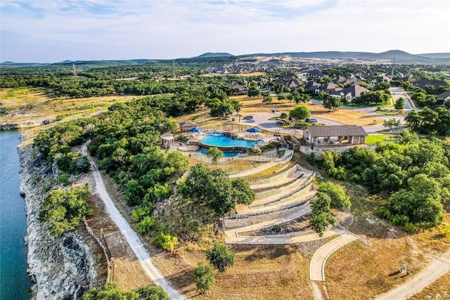 7618 Turnback Ledge Trl, Lago Vista, TX 78645 - aerial overview of property's location with a pool area and a water and mountain view